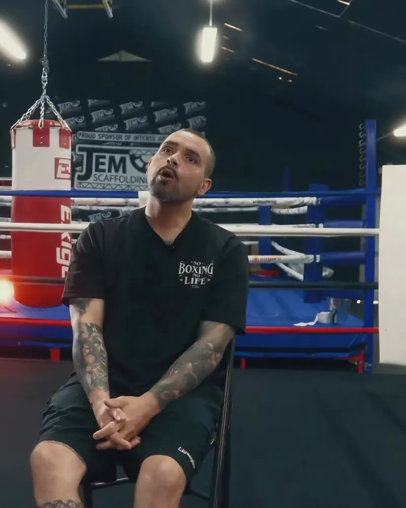 Marlee Dann, founder and professional coach at Intense Boxing, sitting in the gym
