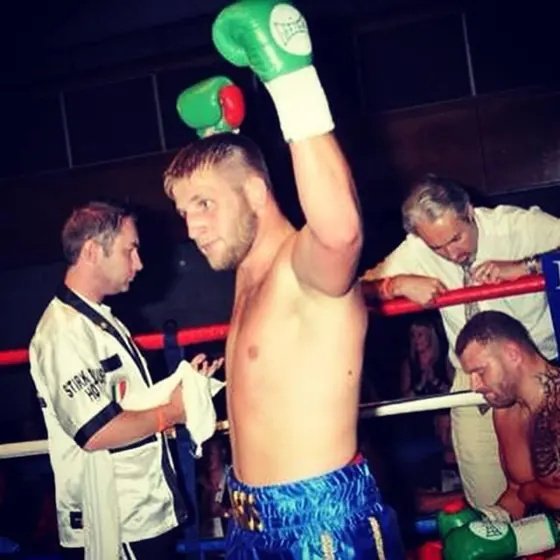 Courtney in the ring, glove raised