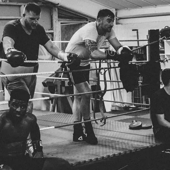 A training session in the gym, black and white