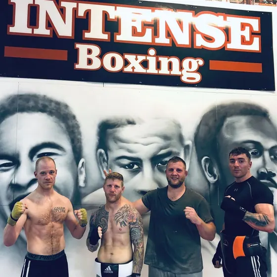 Courtney with teammates under the Intense Boxing banner