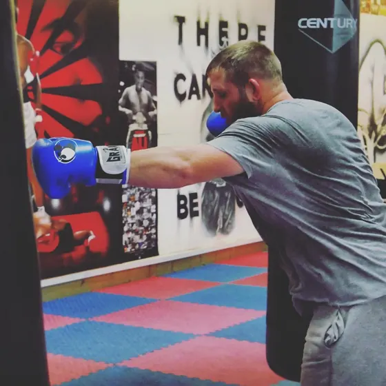Courtney throwing a jab at the heavy bag in the gym