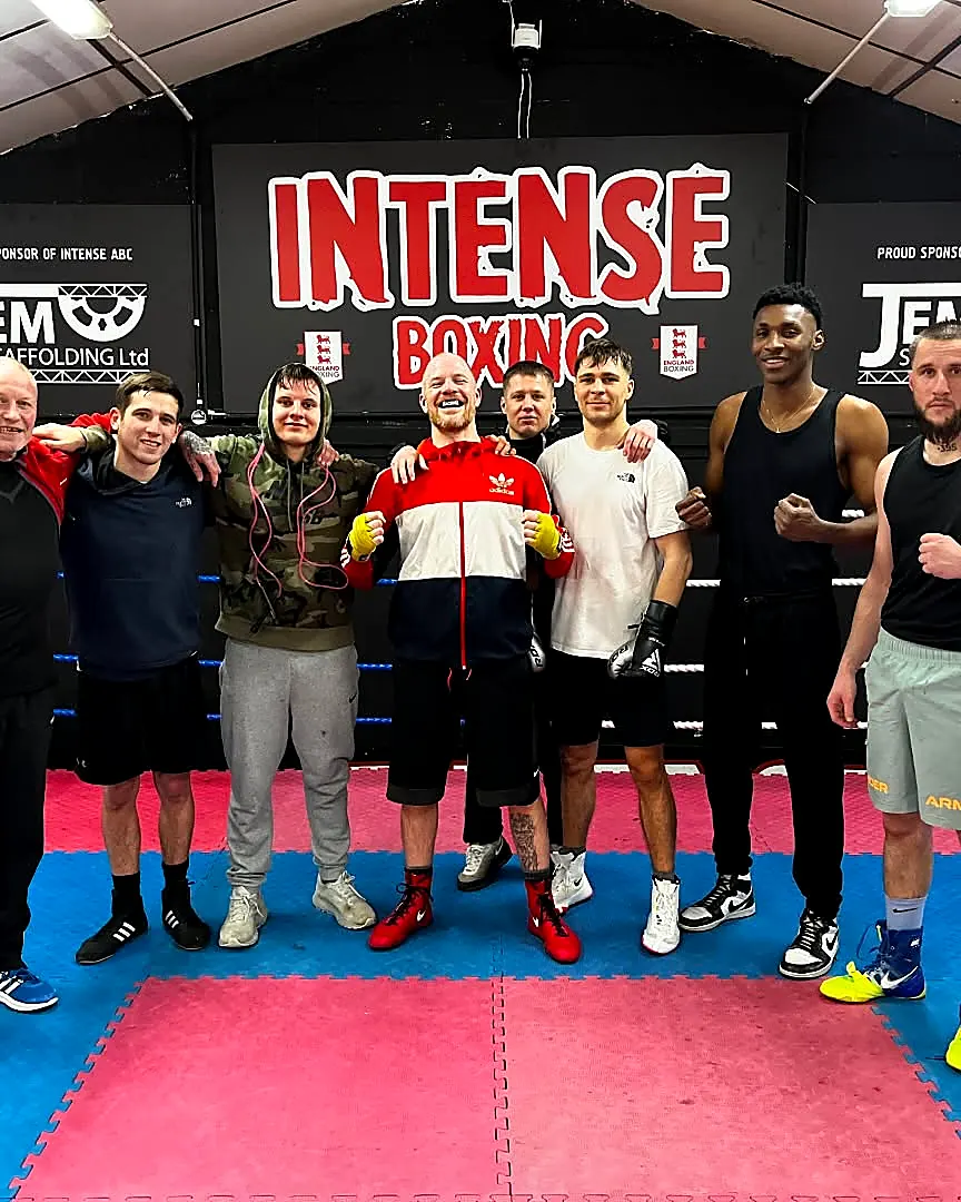Adult boxers training together in the ring at Intense Boxing
