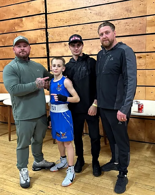 Junior boxer with coaches at Intense Boxing Plymouth